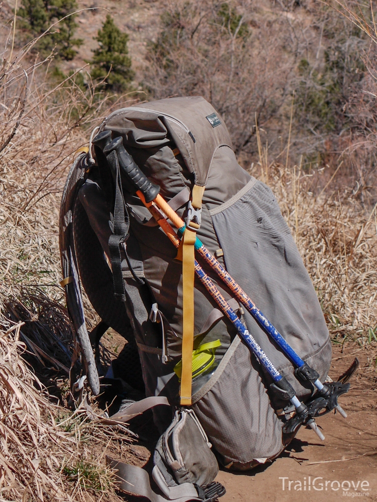 attaching trekking pole to backpack